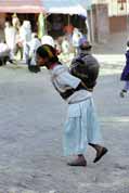 Water carrying from public pipe to house. Lalibela. Ethiopia.