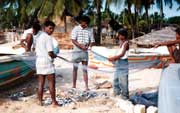 Fishermen on the beach in Arugam Bay. Sri Lanka.