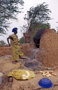 Bread baking. Niafunk� village. Mali.