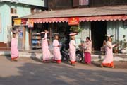 Monks are going through the village each morning. They are gathering the rice for the whole day. Nyaung U. Myanmar (Burma).