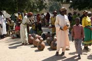 Local alcohol selling is important part of each market. Market at Tourou village at Mandara Mountains. Cameroon.