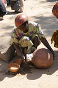 Local alcohol selling is important part of each market. Market at Tourou village at Mandara Mountains. Cameroon.