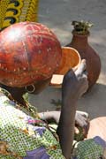 Many locals drink local alcohol which is sold at the market. Market at Tourou village at Mandara Mountains. Cameroon.