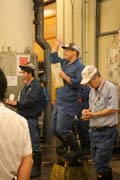 Morning tuna auction - auction is at action. Man is calling prices. Tsukiji fish market, Tokyo. Japan.