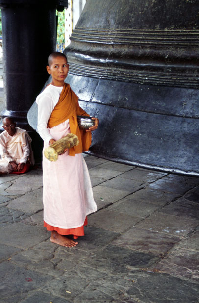 Woman monk near Mingun Bell. Myanmar (Burma).
