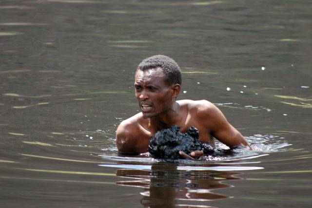 The salt is retrieving from the lake without any mechanization. Salt Lake, El Sod. South,  Ethiopia.