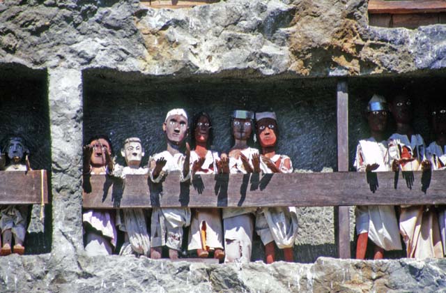 Tau tau figures in front of graves at Lemo. Tana Toraja area. Sulawesi,  Indonesia.