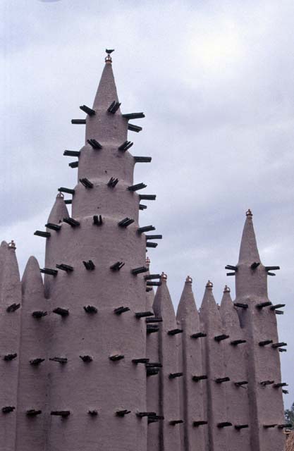 Prayer towers of muddy mosque built at sahel architecture style. Small village near Mopti. Mali.