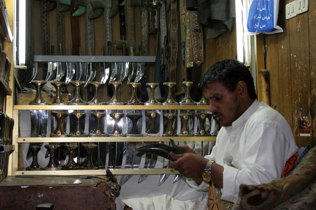 Shop with traditional daggers jambiya - almost every man is decorated by one. Market (souq) at old quarter of Sana city. Yemen.